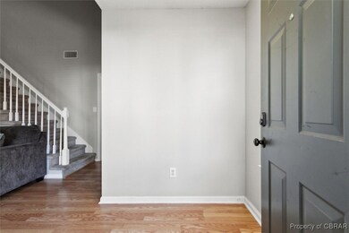 Entrance foyer with visible vents, light wood-styl