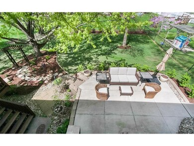 Expansive concrete patio and Japanese shade garden