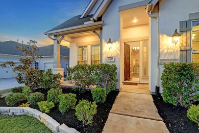 Your regal front entry is lined with native greenery! The covered entrance provides privacy, shelter from the elements and eagerly welcomes guests!