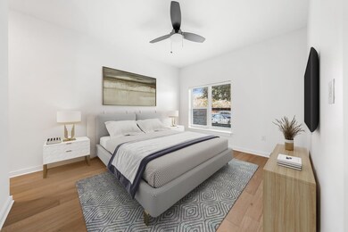Bedroom featuring ceiling fan, baseboards, and wood finished floors