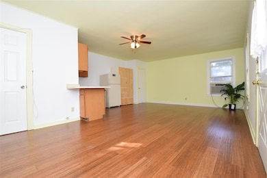 Unfurnished living room featuring cooling unit, b