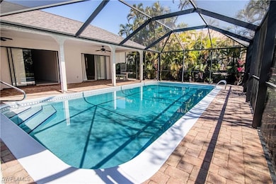 Huge wrap-around pool paver lanai under truss
