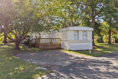 Manufactured / mobile home with a deck and a front