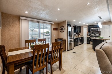 Dining space with light tile patterned floors, rec