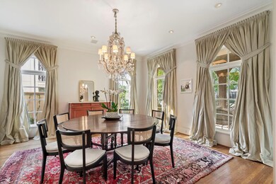 Dining area featuring a notable chandelier, light 