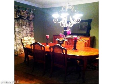 Dining Room. The Dining Room is open to the Foyer and Great Room which allow for expansion when seating large numbers of family or guests. Beautifully appointed with custom draperies which stay with the home.