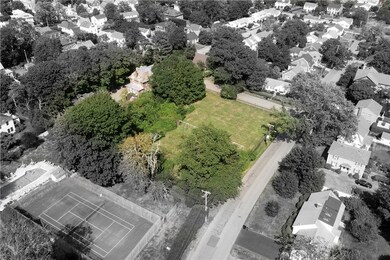 Another aerial angle with property outlined in col