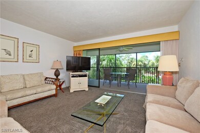 Large, open great room with triple sliders out to