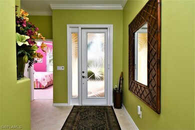 Front door also features a phantom screen to let the cool tropical breezes flow through the home.