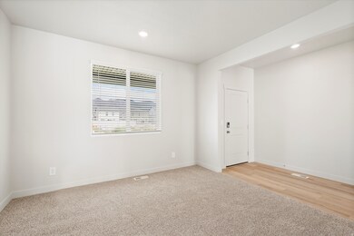 Unfurnished room featuring light carpet and recessed lighting