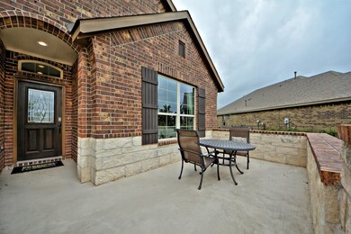 D.R. Horton/Freedom Homes builds your home with extra wide doorways and ramp access at your Garage Entry with Gorgeous Covered Front Porch Entry,Upgraded Coach Lighting to welcome you home in the evenings, Mahogany Wood & Glass Front Door and more! Let's go inside.