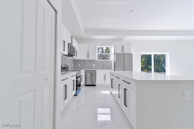 Kitchen with appliances with stainless steel finis