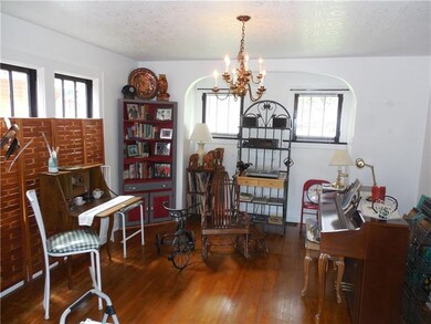 Dining room with lots of light and hardwood curren