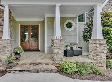 Beautiful wood, glass and iron door with stone ste