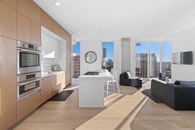 Kitchen featuring expansive windows, double oven,