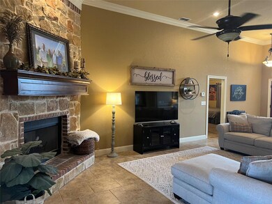 Tiled living room featuring crown molding, ceiling