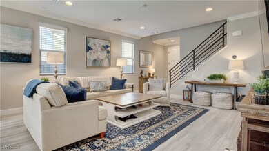 Living area with light wood-style flooring, basebo