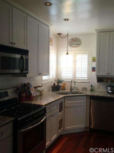 Upgraded kitchen with granite countertops.