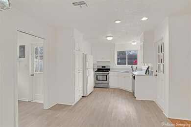 Kitchen has been freshly painted.