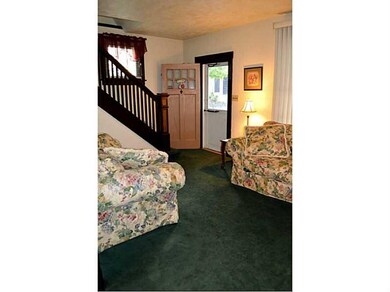 Living Room. Living room features brick fireplace,
