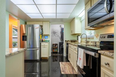Kitchen looking into the laundry room