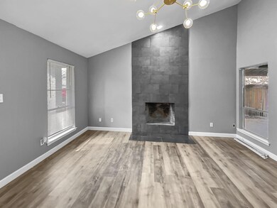 Unfurnished living room with an inviting chandelie