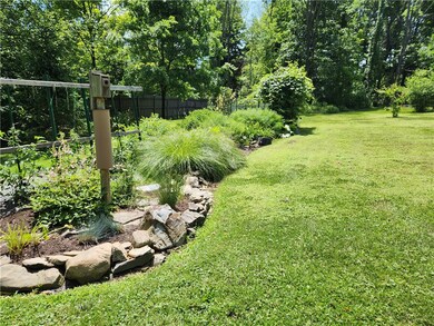 Mature landscaping with several garden spaces to e