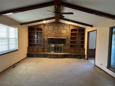 Unfurnished living room featuring visible vents, b
