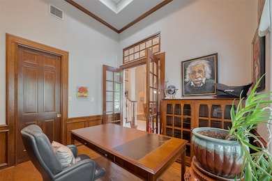 Elegant stained wainscoting and a custom built-in