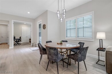Dining space featuring recessed lighting, light wo
