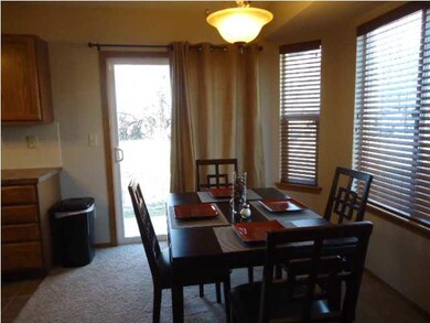 Dining room features custom made wood blinds and n