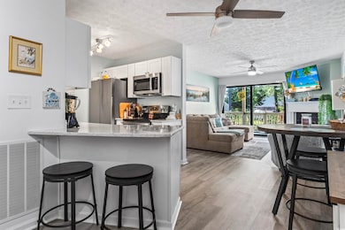 Kitchen featuring stainless steel appliances, a te