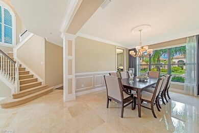 Formal dining room showing detailed custom wood tr