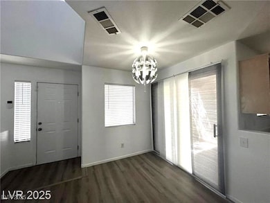 Unfurnished dining area featuring a chandelier and