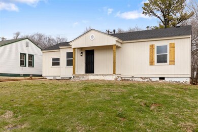 View of front of house featuring a shingled roof, 