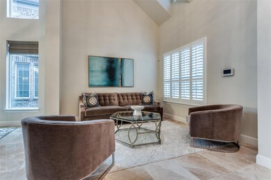 Tiled living room with a towering ceiling