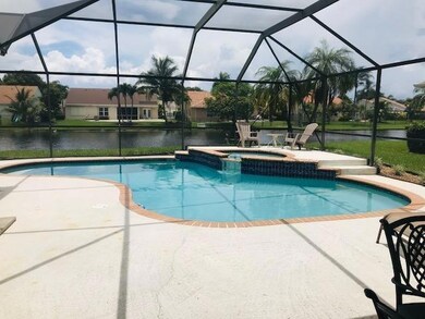 Dome screened pool and spa, overlooking lake