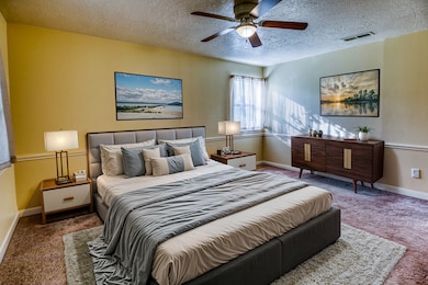 Primary bedroom with attached bath.  *Photo is vir