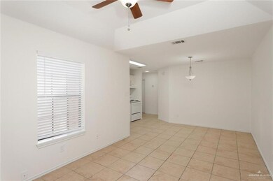 Spare room with light tile patterned floors and ceiling fan