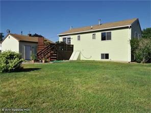 Exterior Back. Large back yard with shed for stora