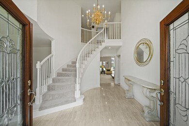 The double lead glass panel doors open to a beauti