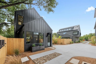 Back of property featuring board and batten siding
