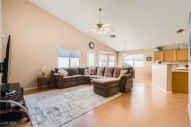 Living area featuring high vaulted ceiling, ceilin