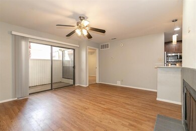 Unfurnished living room featuring a ceiling fan, 