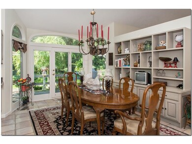 Spacious kitchen area highlighted by built-in wall