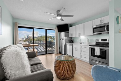 Kitchen featuring light countertops, light wood-st