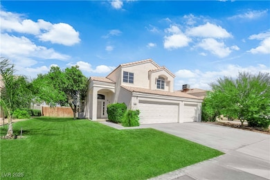 Mediterranean / spanish-style house featuring a tiled roof, driveway, stucco siding, and a garage