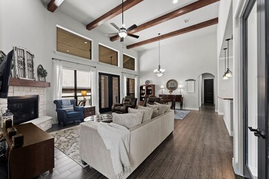 Crisp & pristine family room with porcelain wood tile.