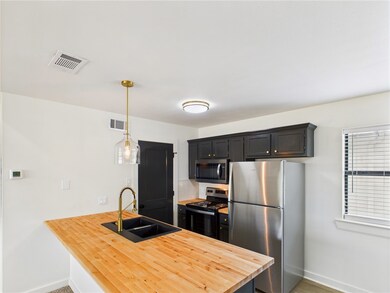 Kitchen with appliances with stainless steel finis