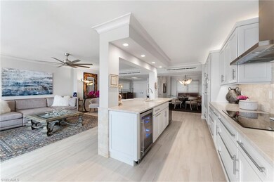 Kitchen featuring wall chimney range hood, wine co